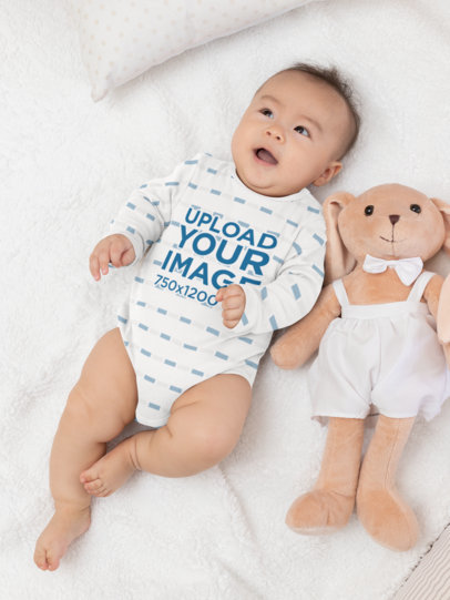 Mockup of a Baby Wearing a Sublimated Onesie in His Crib 