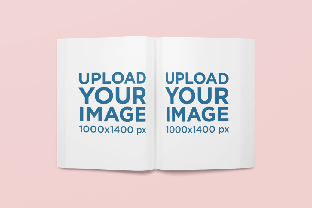 Mockup Featuring an Open Book Lying on a Solid Color Surface 