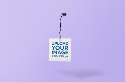 Mockup of a Squared Brand Tag Floating in a Plain Color Set 856-el