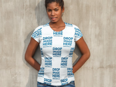 T-Shirt Mockup of a Woman Leaning Against a Concrete Wall