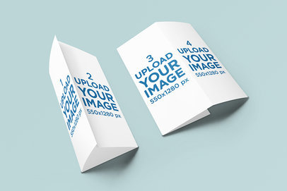 Trifold Brochure Mockup Featuring Two Brochures Lying on a Plain Surface