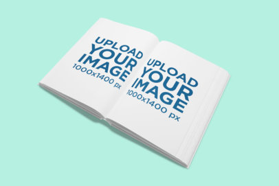 Mockup of an Open Hard-Cover Book on a Solid Color Surface 853-el