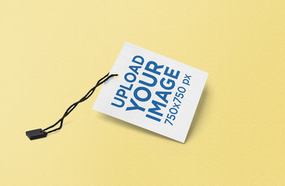  Mockup Featuring a Square Brand Tag Against a Solid Color Backdrop 858-el
