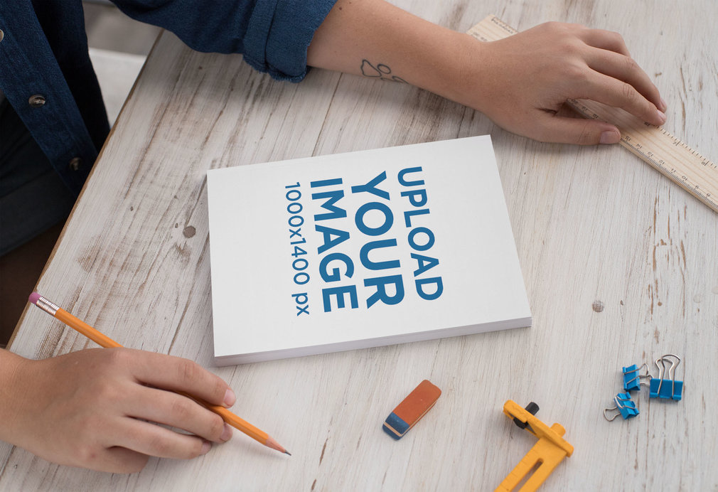Notebook Mockup of a Woman Working 