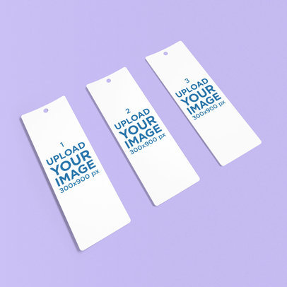 Mockup Featuring Three Bookmarks Lying over a Solid Color Background
