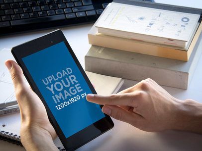 Product Mockup of a Person Using a Nexus 7 in an Office