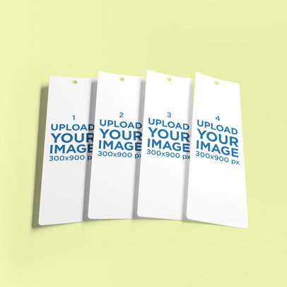Mockup of Four Bookmarks Lying Together on a Customizable Backdrop