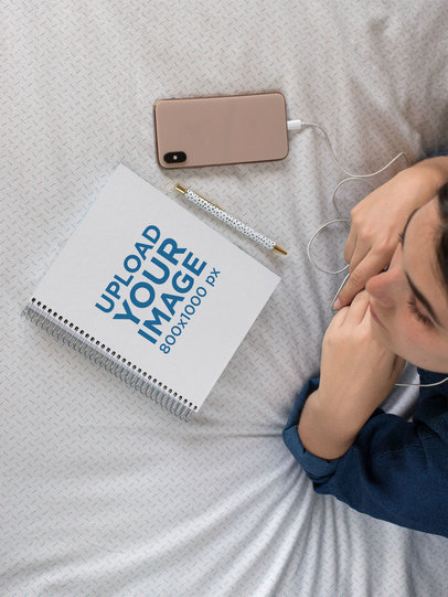Notebook Mockup of a Woman Studying on Her Bed
