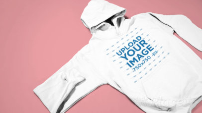 Video of a Pullover Hoodie over a Solid Background