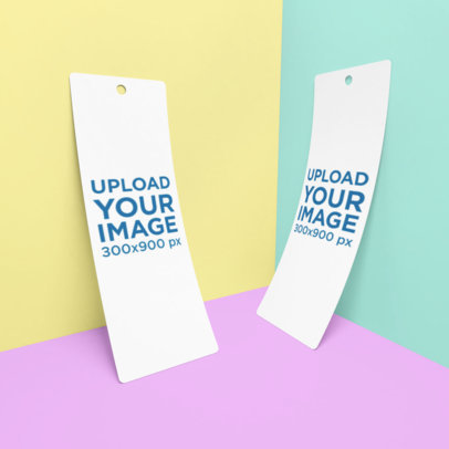 Mockup of Two Bookmarks Leaning on the Corner of a Customizable Setting