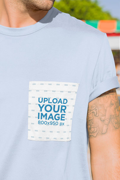 Mockup of a Tattooed Man Wearing a Square Pocket Tee 