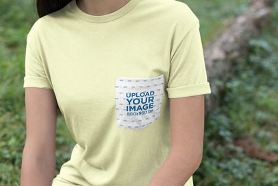 Pocket Tee Mockup of a Woman by a Green Area