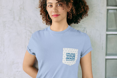 Pocket Tee Mockup of a Woman Wearing a Tee Against a Concrete Wall 30064