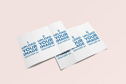 Minimal Mockup Featuring Two Trifold Brochures Lying on a Solid Color Surface