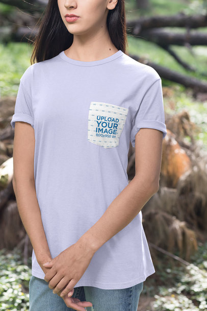 Mockup of a Woman Standing in an Open Area Wearing a Pocket Tee 30077