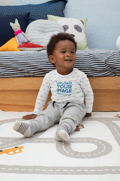 Mockup of a Baby Boy Wearing a Long Sleeve Onesie in His Room