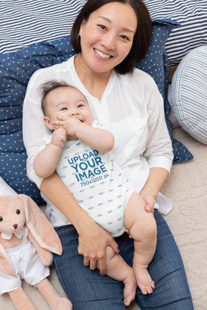 Mockup of a Baby Boy Wearing a Heathered Onesie Smiling with His Mom 