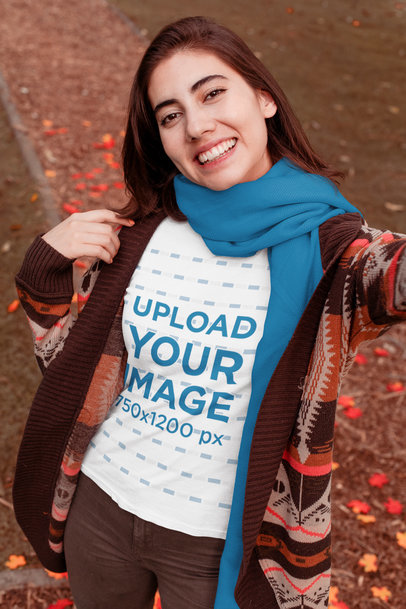 T-Shirt Mockup of a Woman Taking a Selfie in Fall