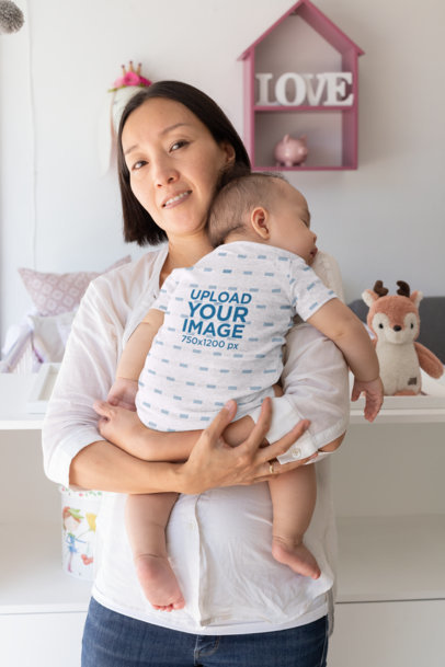 Mockup of a Sleepy Baby Wearing a Onesie 