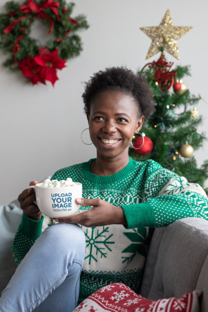 24 oz Mug Mockup Featuring a Woman in a Christmas Decorated Living Room Drinking Cocoa 30347