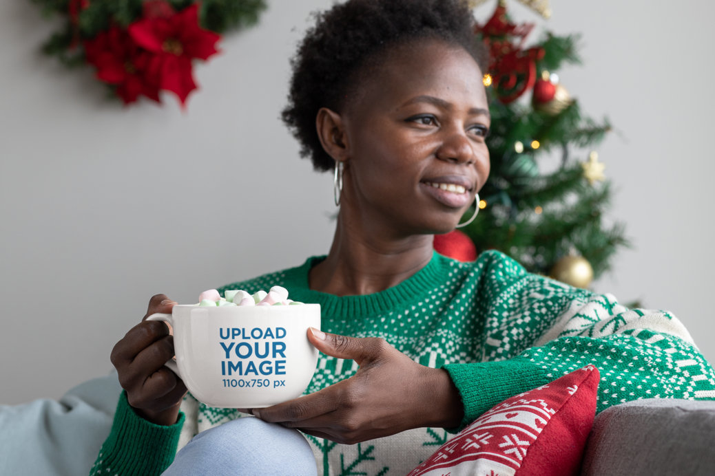 Mockup of a Woman Having a Hot Cocoa With Marshmallows in a 24 oz Mug 