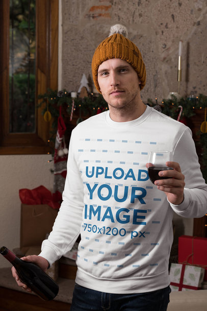 Christmas Mockup of a Man Wearing a Crewneck Sweatshirt and Drinking Wine