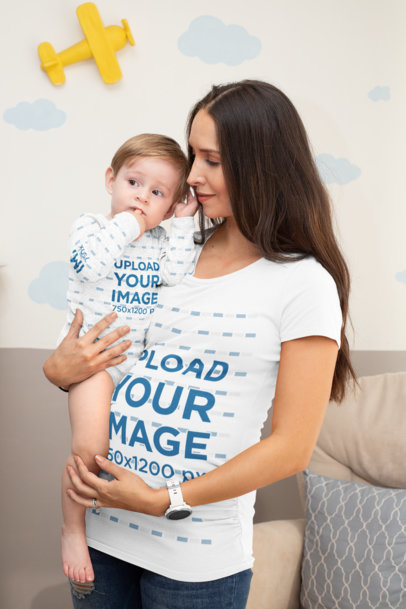 Mockup of a Mom Wearing a Customizable T-Shirt While Holding Her Baby with a Sublimated Onesie 