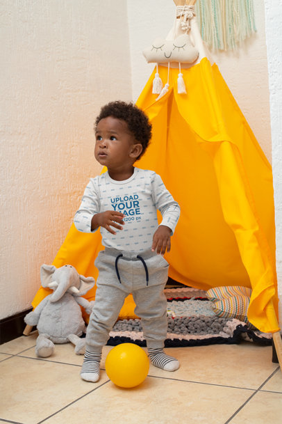 Onesie Mockup of a Boy Playing in a Tipi 30032