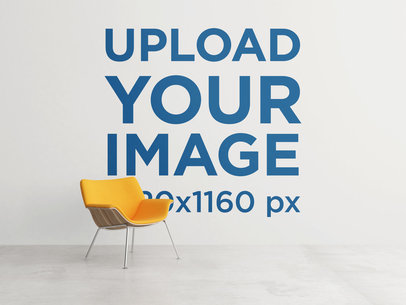 Art Print Mockup of an Art Wall Behind an Orange-Color Chair