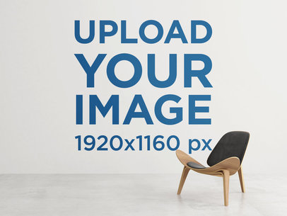 Art Print Mockup of a Whole Wall Behind a Trendy Wooden Chair 