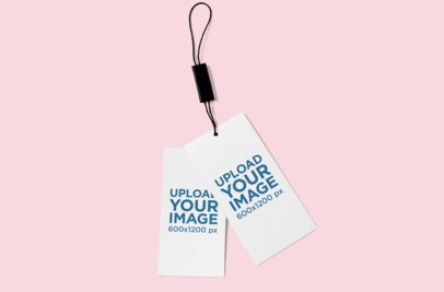 Mockup Featuring Two Brand Tags Lying on a Solid Color Surface 864-el