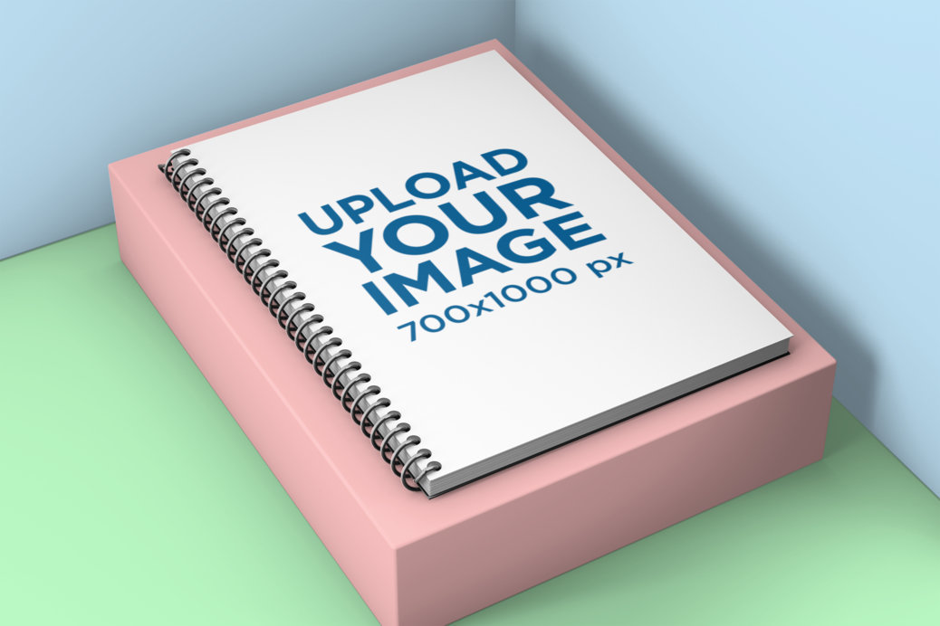 Mockup of a Spiral Notebook on a Small Pedestal 