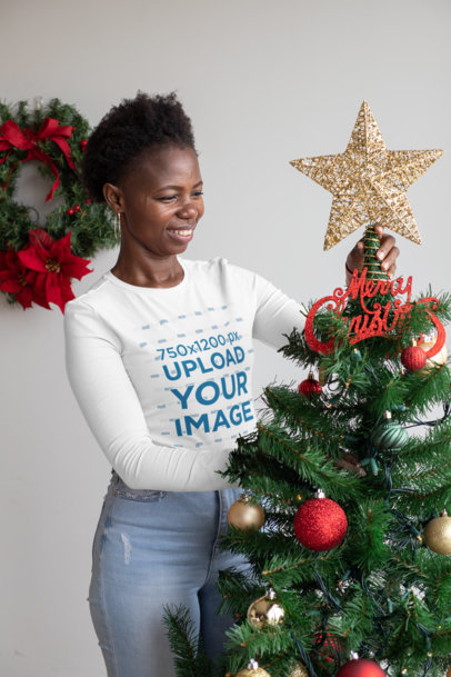 Long Sleeve Tee Mockup of a Happy Woman Placing the Christmas Tree Star