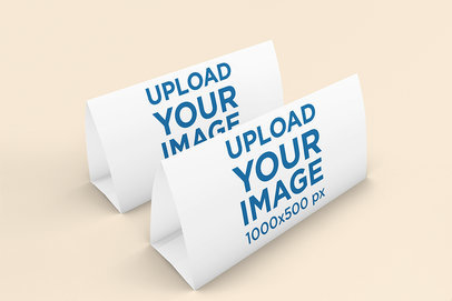 Mockup Featuring Two Desk Calendars Standing Against a Solid Color Backdrop