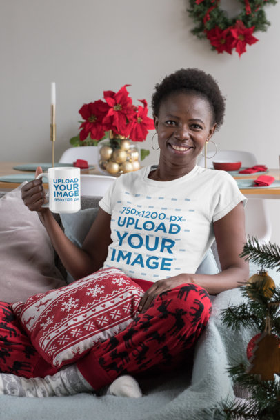 T-Shirt Mockup of a Woman Holding a 15 oz Coffee Mug at a Christmas Decorated Living Room 30362