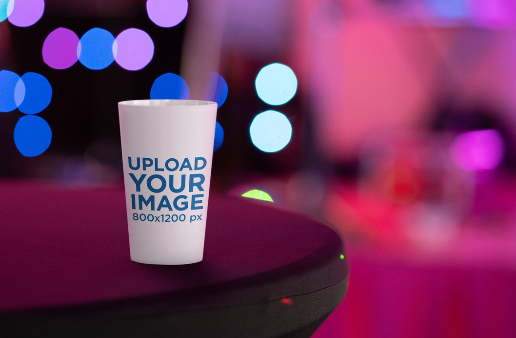 Reusable Cup Mockup Featuring a Blurry Background 