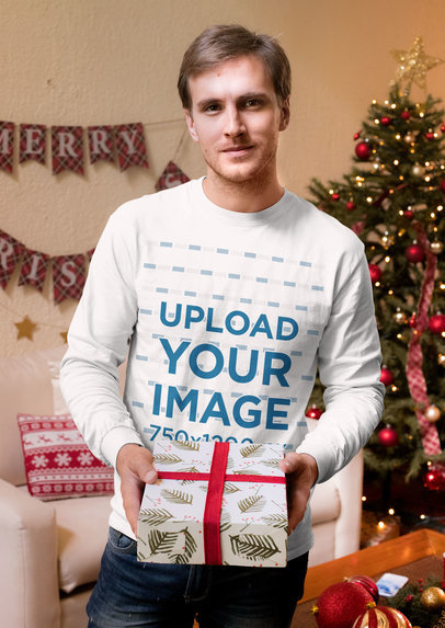 Long Sleeve Tee Mockup of a Man Holding a Christmas Gift