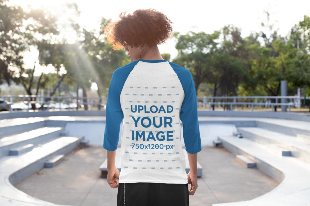 Back View Mockup of a Young Man Wearing a Three-Quarter Sleeve Raglan Tee