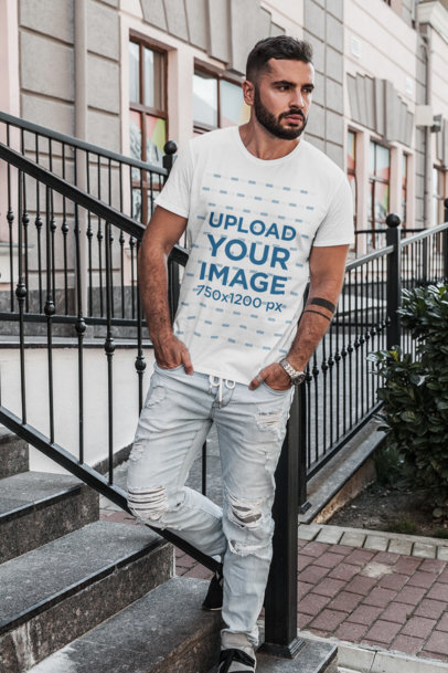 T-Shirt Mockup of a Serious-Looking Man Standing on Concrete Steps 1023-el