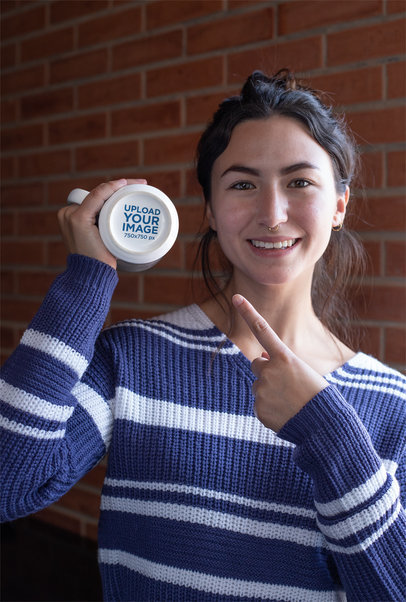 Mockup of a Smiling Woman Pointing at a 15 oz Secret Message Mug