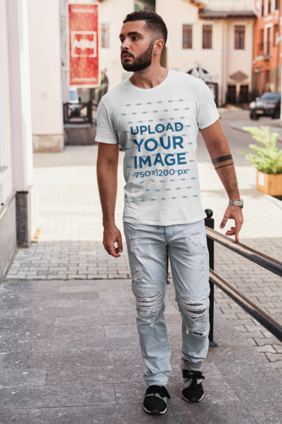 T-Shirt Mockup of a Bearded Man Walking on a Concrete Ramp 