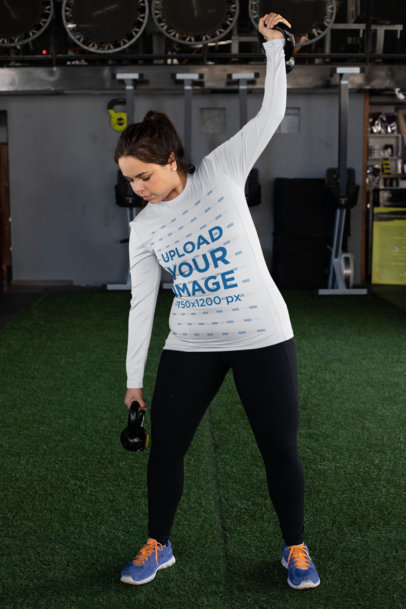 Plus Size Mockup of a Woman with a Long Sleeve Tee Lifting Some Weights 