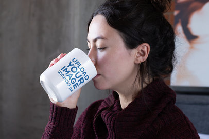 Mockup of a Woman Drinking From a 15 oz Coffee Mug