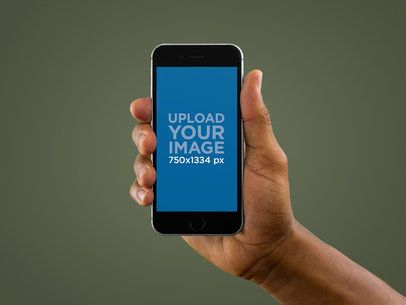 iPhone Mockup Being Held in Portrait Position by a Black Man