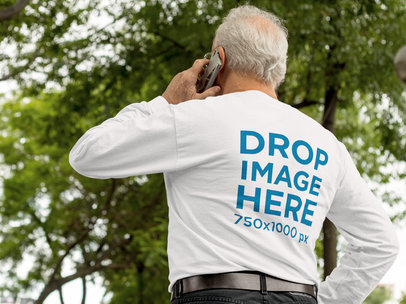 Mockup of the Back of an Elder Man Wearing a Long-Sleeve T-Shirt While Talking on his Phone b10942