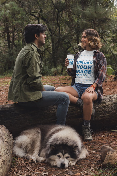 T-Shirt Mockup of a Woman Chatting with a Friend While Drinking from a Tumbler