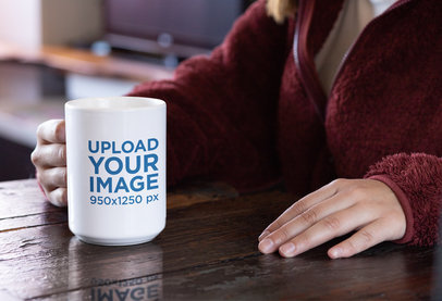 15 oz Coffee Mug Mockup Featuring a Woman Sitting at a Wooden Table