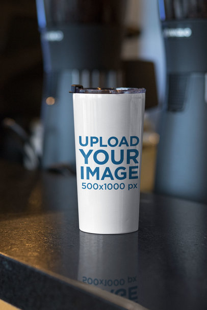 Travel Mug Mockup Placed on a Kitchen's Bar