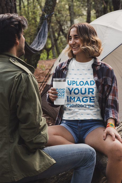 T-Shirt Mockup of a Woman at a Campsite Holding a Travel Mug 