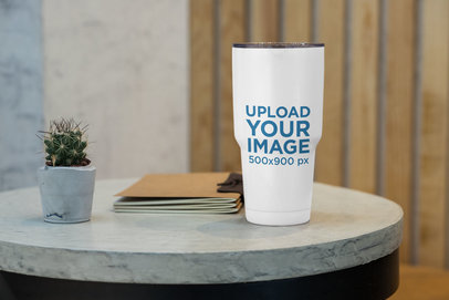 Mockup of a 30 oz Travel Mug on a Concrete Table